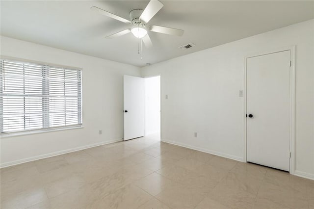 empty room featuring ceiling fan