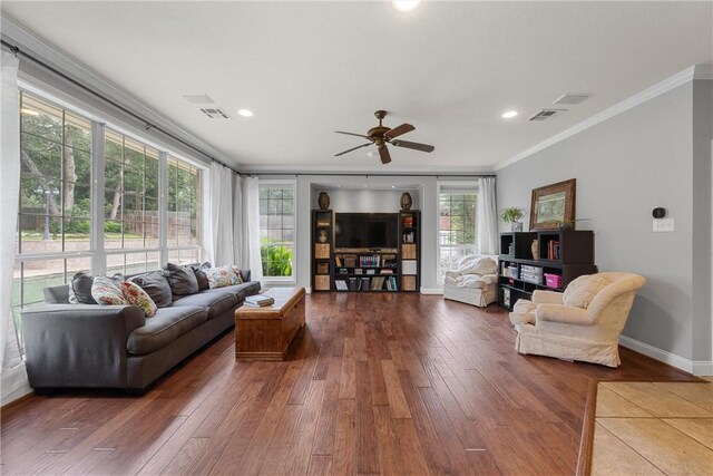 living room featuring ceiling fan, dark wood-type flooring, and ornamental molding