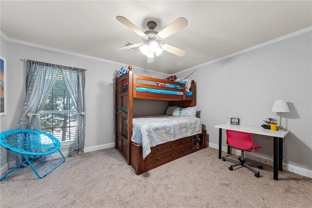 carpeted bedroom featuring ceiling fan and crown molding