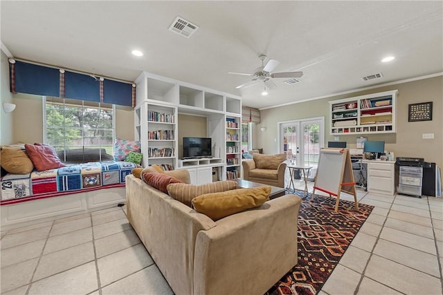 living room with french doors, plenty of natural light, ornamental molding, and ceiling fan