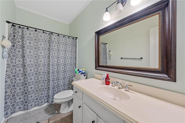 bathroom with tile patterned floors, vanity, toilet, and crown molding