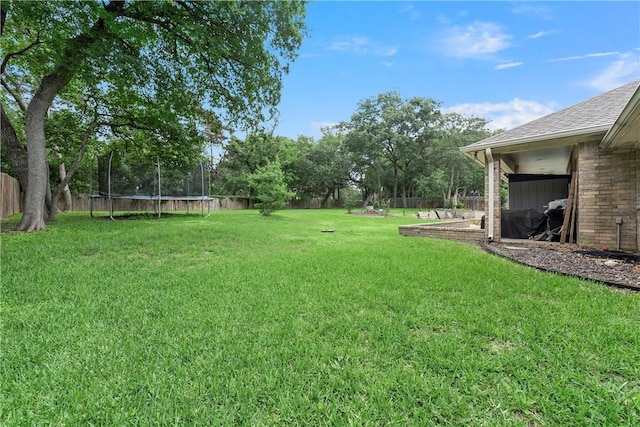 view of yard with a trampoline