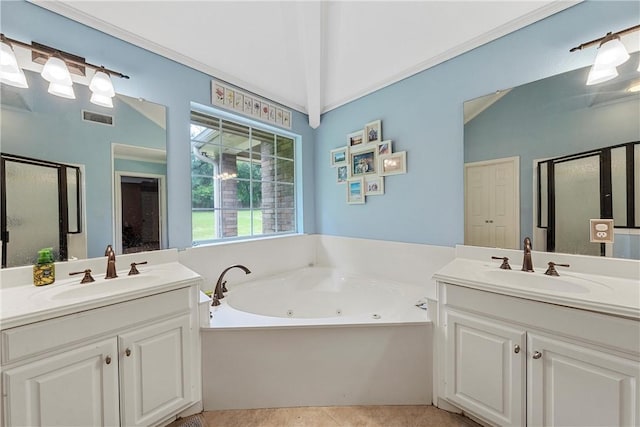 bathroom featuring tile patterned flooring, vanity, independent shower and bath, and vaulted ceiling