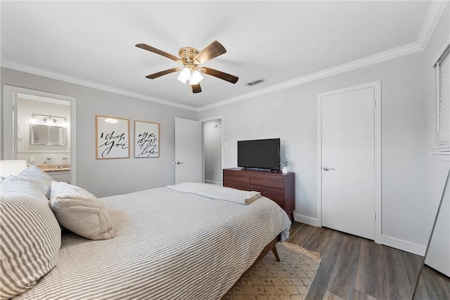 bedroom with visible vents, connected bathroom, crown molding, and wood finished floors