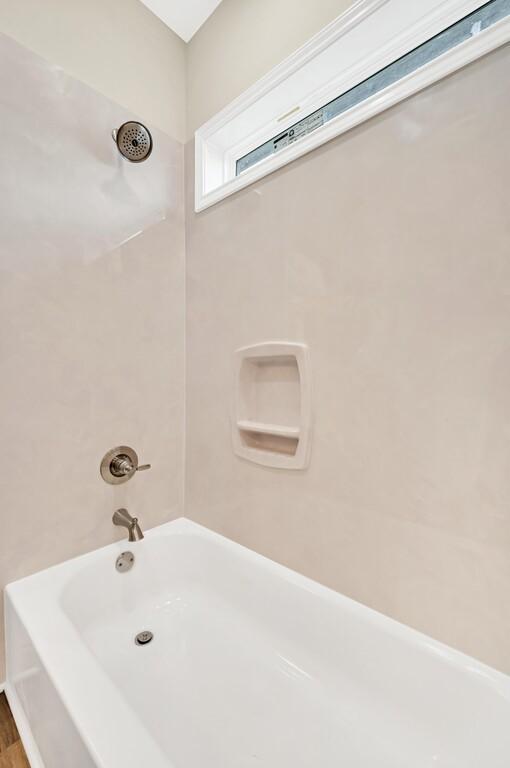 bathroom with shower / bathtub combination