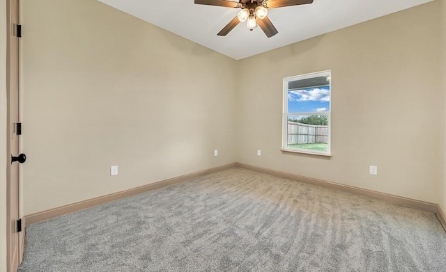 spare room with light carpet and ceiling fan