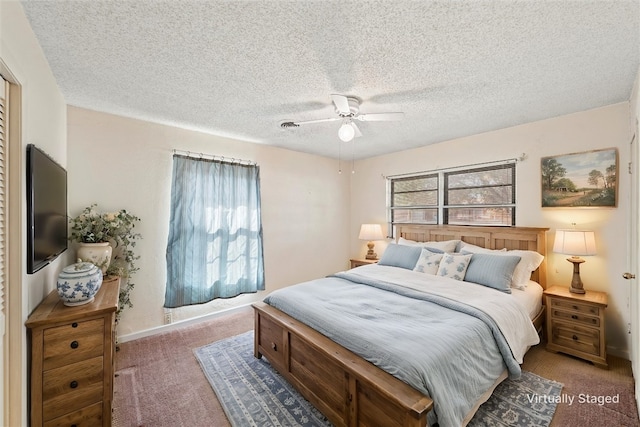 carpeted bedroom with ceiling fan and a textured ceiling