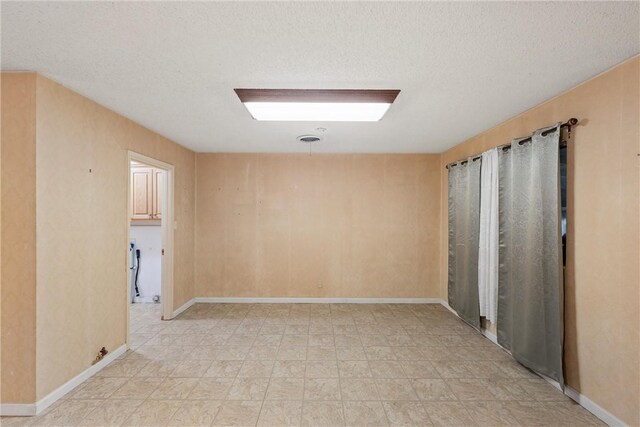 interior space with a textured ceiling