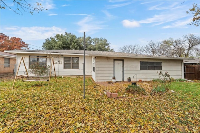 ranch-style house featuring a front lawn