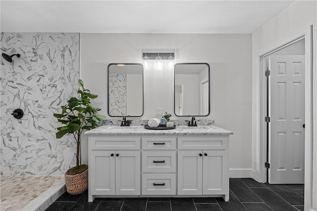 bathroom featuring tile patterned floors, a shower, vanity, and tile walls