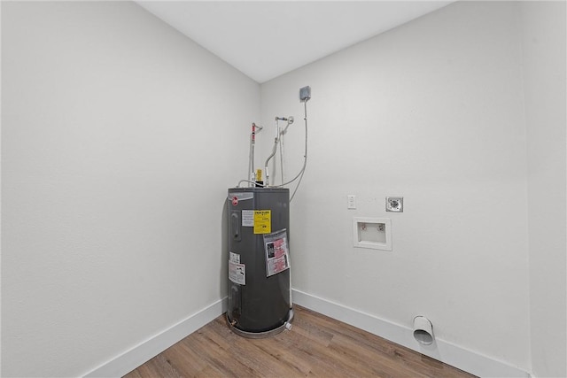 laundry area featuring washer hookup, electric water heater, hardwood / wood-style flooring, and electric dryer hookup