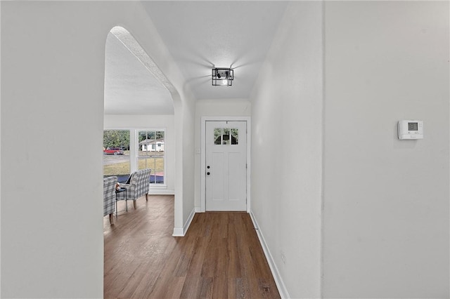 doorway to outside featuring hardwood / wood-style floors and a textured ceiling