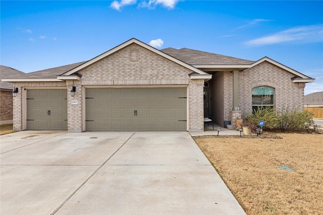 ranch-style home featuring a garage