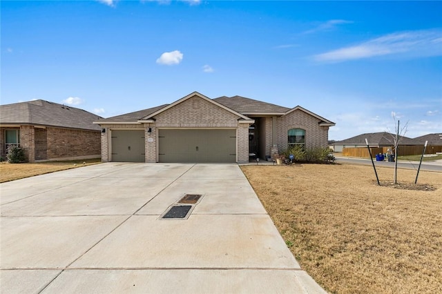 ranch-style house with a garage and a front yard