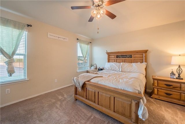 bedroom with carpet floors, multiple windows, and ceiling fan