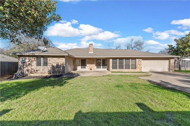 ranch-style home featuring driveway, a front lawn, fence, an attached garage, and a chimney