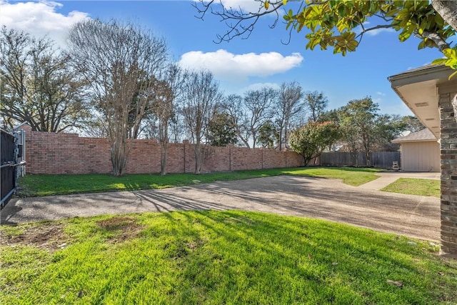 view of yard with a fenced backyard