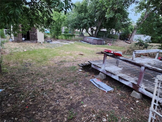 view of yard with a wooden deck