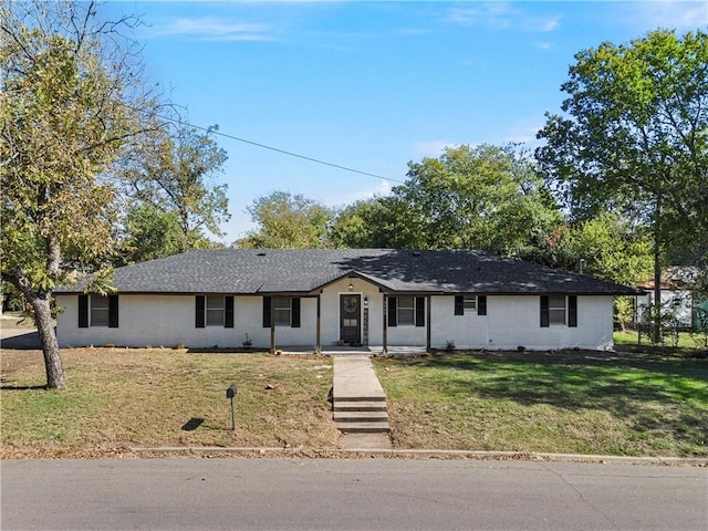 ranch-style home with a front lawn