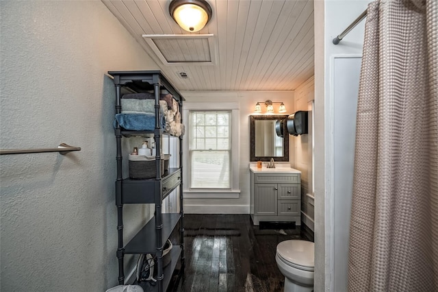 bathroom featuring hardwood / wood-style flooring, vanity, walk in shower, toilet, and wooden ceiling