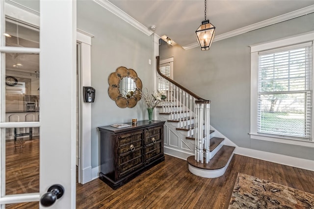 stairs featuring crown molding and hardwood / wood-style flooring