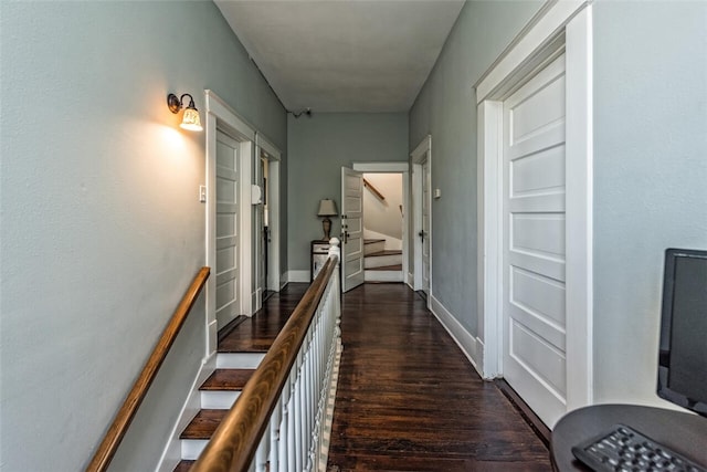 hall with dark hardwood / wood-style floors