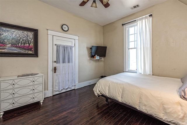 bedroom featuring ceiling fan and dark hardwood / wood-style flooring