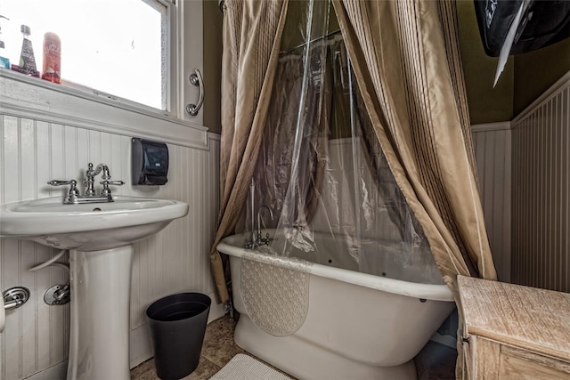 bathroom featuring sink and shower / bath combo with shower curtain