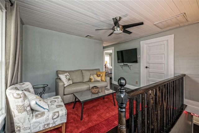 living room with wooden ceiling and ceiling fan