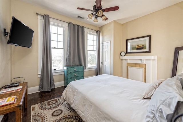 bedroom featuring ceiling fan and dark hardwood / wood-style flooring