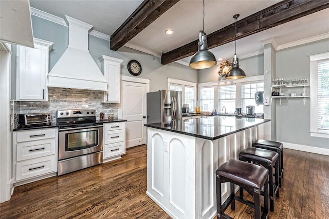 kitchen with a kitchen island, white cabinetry, stainless steel appliances, custom range hood, and beam ceiling