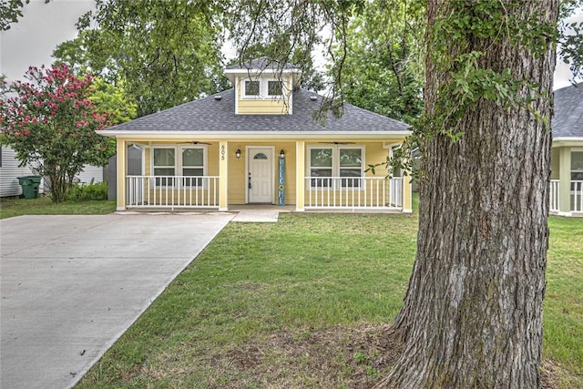 bungalow-style home with covered porch and a front lawn