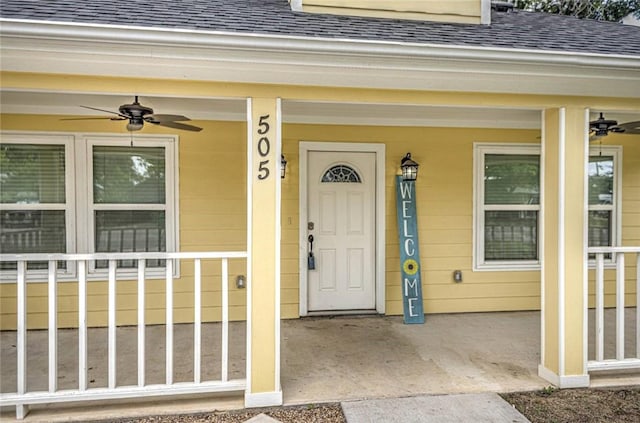 entrance to property with ceiling fan and covered porch