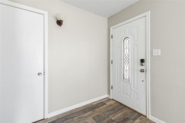 entryway with dark hardwood / wood-style floors