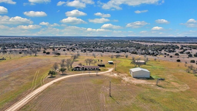 birds eye view of property featuring a rural view