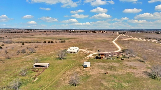 birds eye view of property with a rural view