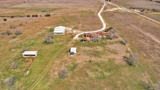 birds eye view of property with a rural view