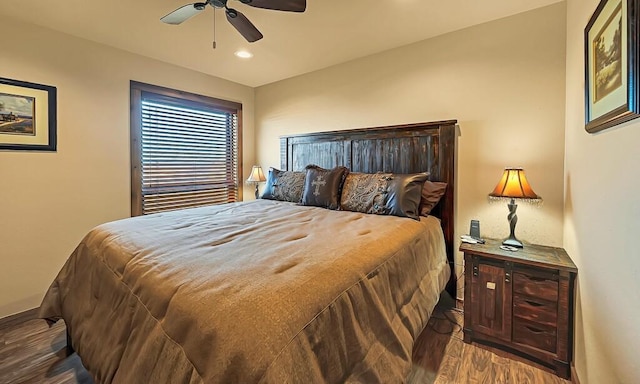 bedroom with wood-type flooring and ceiling fan