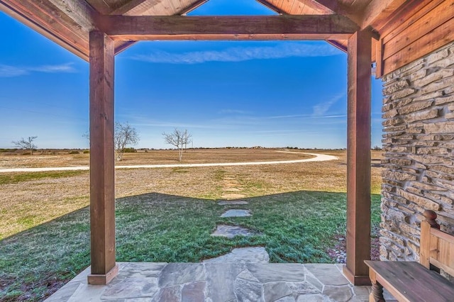 view of yard with a rural view