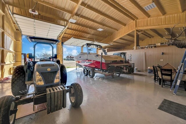 garage featuring wooden walls