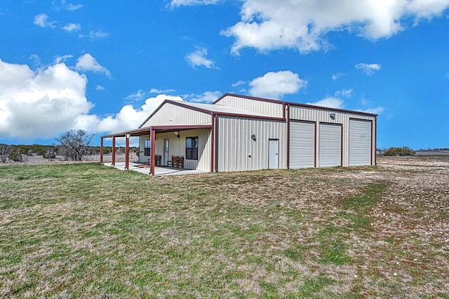 exterior space featuring a garage and a yard