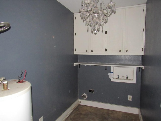 laundry area featuring a notable chandelier and water heater