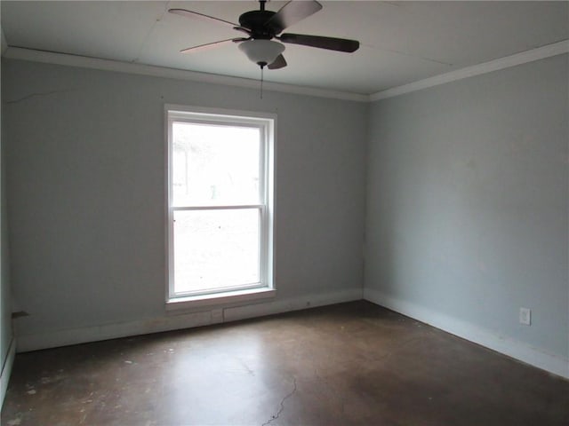 spare room with concrete flooring, ceiling fan, and ornamental molding