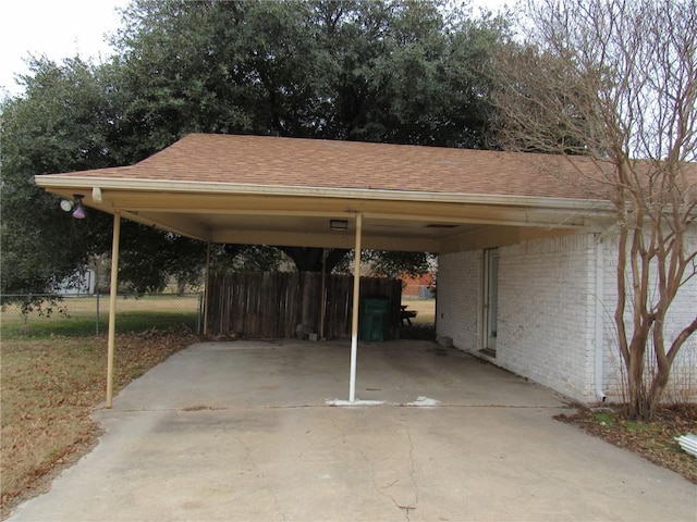 view of parking / parking lot featuring a carport