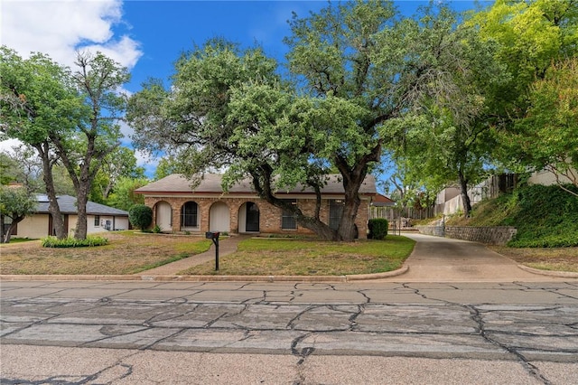 view of front of property with a front lawn