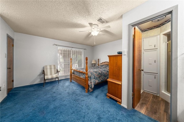 carpeted bedroom with a textured ceiling and ceiling fan