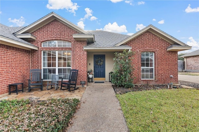 front facade with a front lawn