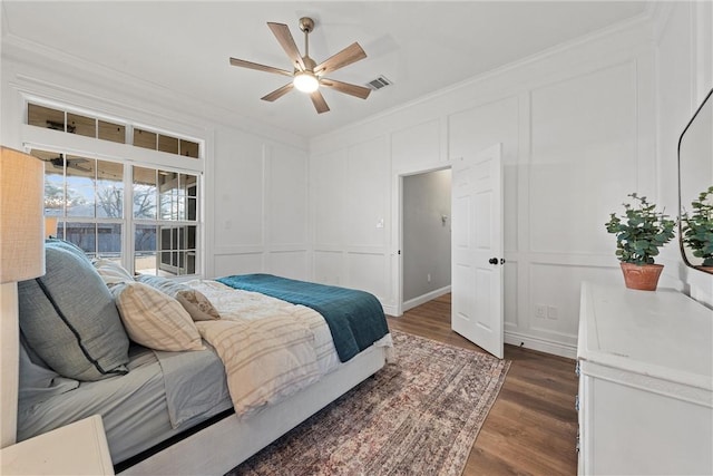 bedroom with access to exterior, crown molding, dark hardwood / wood-style floors, and ceiling fan