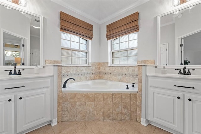 bathroom with tile patterned flooring, ornamental molding, a relaxing tiled tub, and vanity