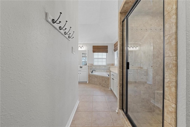 bathroom with tile patterned flooring, vanity, and separate shower and tub